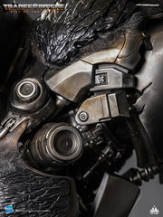 Close-up of the figure's chest and shoulder design, showcasing mechanical details